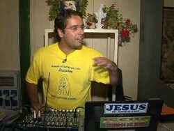 VOICED: Deejay priest gets them rocking for Jesus on Italian beach News Clip