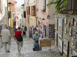  WS Tourist walking in souvenir shops in old town / Rovinj, Istria, Croatia Stock Footage