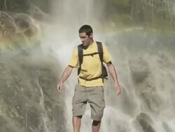 Couple at picturesque waterfall Stock Footage
