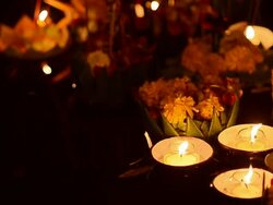 many kind of Krathong soar on riverbank Stock Footage