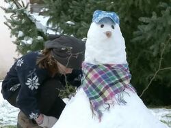 MS Girl making   snowman / Saarburg, Rhineland-Palatinate, Germany Stock Footage