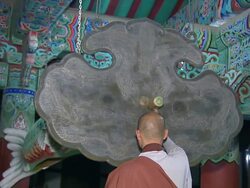 MS Monks are hitting ornate temple bell by wooden ram / Hapchun, Gyeongsangnamdo, South Korea Stock Footage