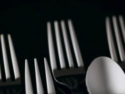 ECU PAN Many place setting are lined up in black backdrop / Seoul, South Korea Stock Footage