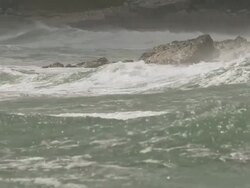 MS PAN SLO MO Waves crashing on rock / Elephant Beach, Falkland Islands, Falkland Islands Stock Footage