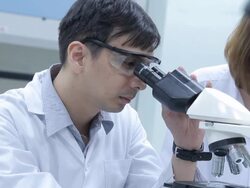 HD : Scientist Couple using microscope Stock Footage