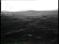 Hoggar mountain range, the Tuaregs, Bedouin tribesmen load camels with salt to travel across desert, Algeria 1957 Stock Footage