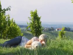 HD DOLLY: Woman With Her Dog Lying In Grass Stock Footage