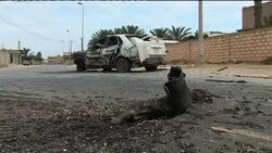 Smoke billows from port after attack, migrants waiting News Clip