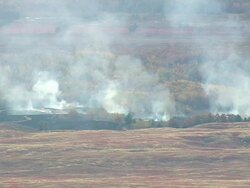 WS ARIEAL ZI ZO View of Smoke of burning blueberry fields / Maine, United States Stock Footage