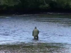 WS Fly fisherman standing in the shallows of Loch Ness / Highlands, Scotland, United Kingdom Stock Footage