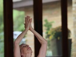 MS TU TD PAN Senior woman doing yoga in studio / Richmond, Virginia, United States Stock Footage