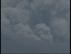 CU grey smoke and ash cloud billow from crater into sky, Mount Tunguragua, Ecuador Stock Footage