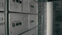 Storage with safe lockers. Taking a key from keyhole Stock Footage