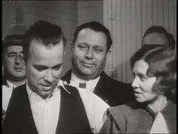 Gangster John Dillinger poses with Sheriff Lillian Holley and prosecutor Robert Estill. News Clip