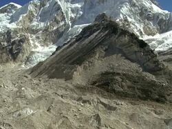 Prominent Himalayan peak and a glacier flowing down through a valley. Stock Footage