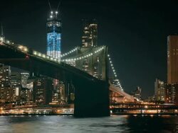 MS TL Night view of Brooklyn Bridge with One World Trade Center in background / New York, New York, USA Stock Footage