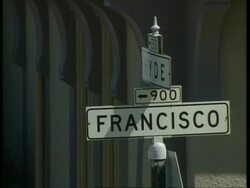 CU Francisco street sign with arched patterns from building in background, San Francisco Stock Footage