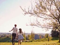 SLO MO Mother and daughter running on the lawn Stock Footage