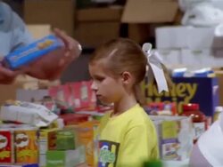 September 2005 Medium shot pan volunteers sorting food inside Hurricane Katrina relief center / Mississippi Stock Footage