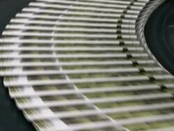 CU Newspapers passing on conveyor belt in gravure printing office / Itzehoe, Schleswig-Holstein, Germany  Stock Footage