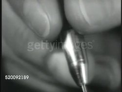 1936: DENTIST OFFICE: Adult male face w/ mouth open, dental mirror going into mouth. CU TU Dentist drill. CU Adult male making face, saying it doesn't work on him. Instructional Video