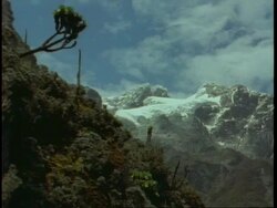 Zoom in to snow covered mountain top, Uganda, Africa Stock Footage