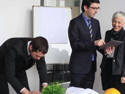 Team of architects going over blueprints Stock Footage