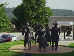 Bronze statue of "The Little Rock Nine" segregated Little Rock Central High School students Stock Footage