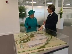 Queen and Duke of Edinburgh looking at scale model News Clip