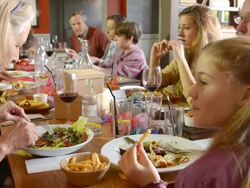 MS Shot of Festive lunch in pub with Three generations of family, Two Grandmas and mum and dad and Two girls and boy / London, England, United Kingdom Stock Footage
