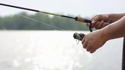 Fishing out on a lake during vacation Stock Footage