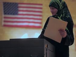 November 2, 2010 R/F A voter from the Arab community filing her completed ballot / Dearborn, Michigan, United States Stock Footage