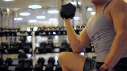 Man Doing Muscle Strength Exercise Workout at GYM Stock Footage