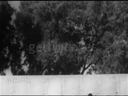 1950: BASEBALL: EXHIBITION GAME: HA WS Game play, Jim Lemon (#14) at bat, hitting, running, outfielder #34 running toward fence, ball out of park, Jim Lemon trotting bases. Instructional Video