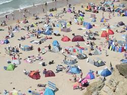 Tourists enjoy Watergate bay, Newquay, Cornwall Stock Footage
