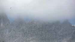 Paraglider flying over the Wilder Kaiser Valley Stock Footage