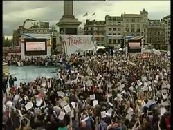 Crowds cheering Olympic announcement News Clip
