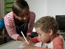 HD: Teacher looking at young Students Progression Stock Footage