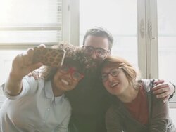 Young friends talking by a window Stock Footage