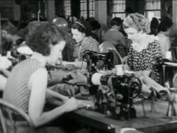 B/W 1934 women sewing at machines in WPA garment factory / documentary Stock Footage