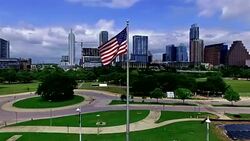 American Flag in Front of Austin Texas Downtown Skyline Stock Footage