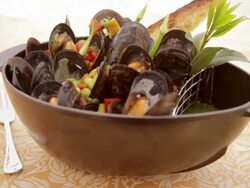 Close up of steamed mussels in bowl Stock Footage