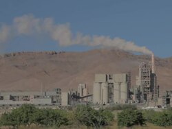Cement Factory on the green field wide shot Stock Footage