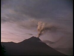 WA grey smoke and ash cloud billow from crater into sky, zoom in to MS, Mount Tunguragua, Ecuador Stock Footage