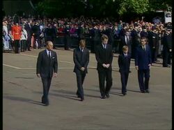 September 6, 1997 FILM MONTAGE MS Carriage and guards passing in front of Prince Philip, Prince William, Prince Edward, Prince Harry, and Prince Charles walk behind/ MS PAN Family walking past gate/ OH  PAN Casket entering church/ London, England/ AUDIO Stock Footage