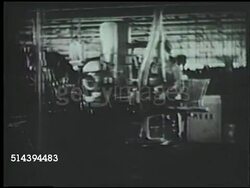 1943: JAPANESE WAR PRODUCTION: INT MS PAN (R) Female Japanese factory workers operating machinery in factory, plant. WWII, World War II, Japanese home front Instructional Video