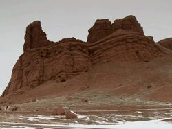 WS Three cowboys trotting on horses in front of red rock landscape / Shell, Wyoming, United States Stock Footage
