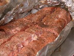 "CU of cooked salmon in tin foil, pans down, Metlakatla, Annette Island, Alexander Archipelago, Alaska." Stock Footage