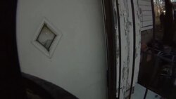 Slow Motion firefighters force open door and enter burning home Stock Footage