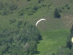 WS AERIAL TS Shot of Paraglider flying / Wyoming, United States Stock Footage